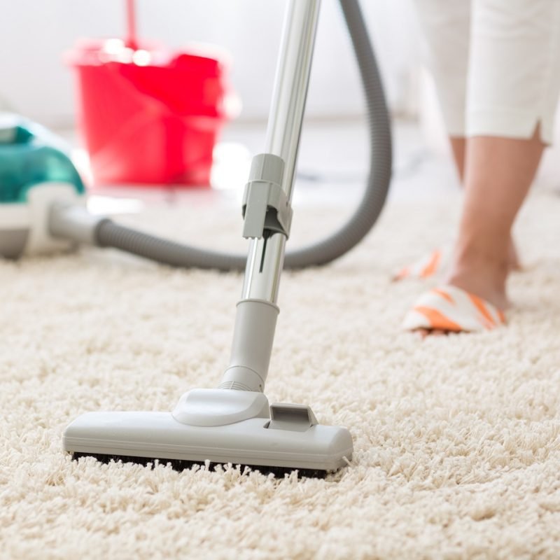 Suction grey carpet cleaning with vacuum cleaner